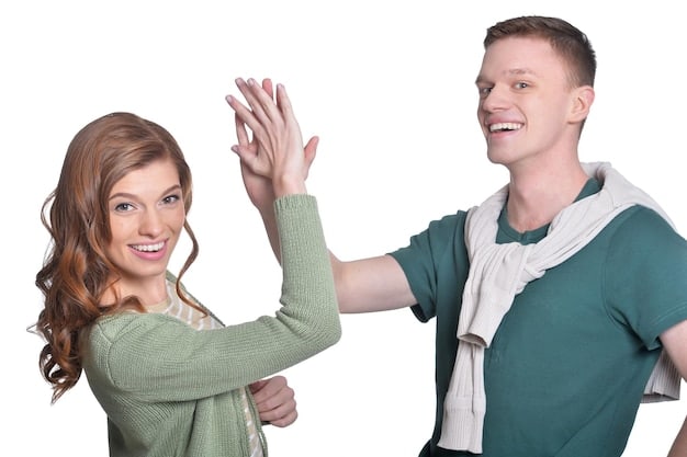 Two friends, a man and a woman, are smiling and waving at each other through a holographic video call. The background shows a shared virtual space resembling a cozy café, enhancing the feeling of being together despite the distance. Advanced light technologies are visible, suggesting sophisticated connectivity.