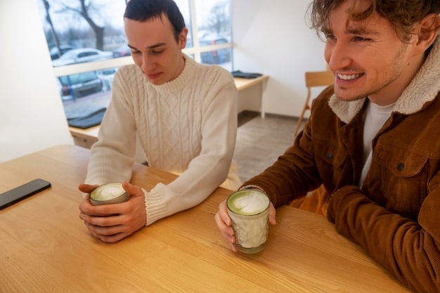 Two friends having coffee. One is actively listening, nodding, and maintaining eye contact, while the other is speaking with a slightly downcast expression. The focus is on the supportive body language and empathetic atmosphere.