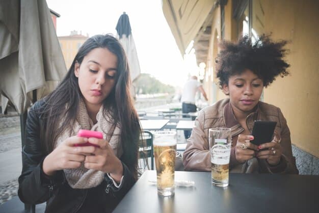 A split image; on one side, people are engrossed in their phones, ignoring each other at a coffee shop; on the other, friends are engaged in a lively conversation, laughing and making eye contact.