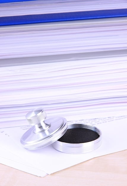 A gavel striking down on a pile of digital documents and images, symbolizing the legal implications of copyright infringement in an online context. The background is blurred to focus on the gavel's impact.
