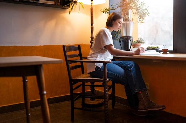 A person sitting alone in a cozy coffee shop, working on a laptop with a cup of coffee next to them. The scene is peaceful and focused, representing an introvert engaging in online networking activities.