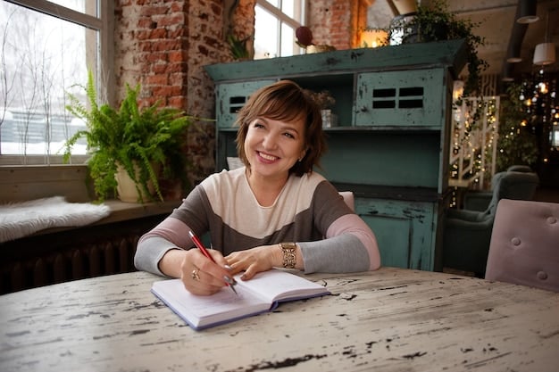 A person sitting at a desk or table, writing in a notebook and smiling, engaged in actively planning their networking goals and strategies. There are pens and sticky notes in the notebook for additional planning.