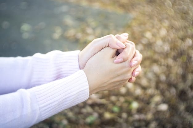 A close-up shot of two hands clasped together in gratitude, with soft, natural light highlighting the texture of the skin and the warmth of the connection. In the background, there are blurred images of people smiling, suggesting a sense of community and shared appreciation.