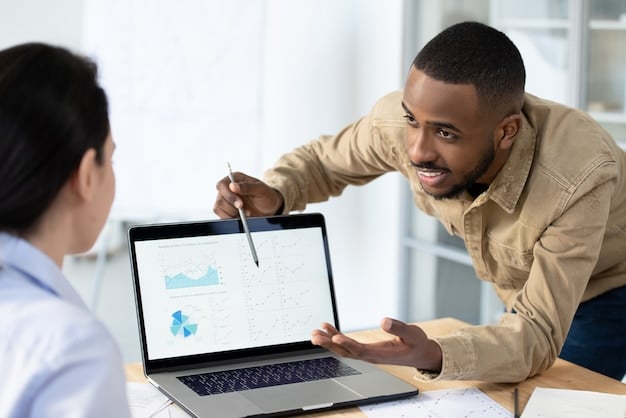 A person reviewing event feedback forms on a laptop, with graphs and charts visible, illustrating the importance of post-event analysis for future improvements.