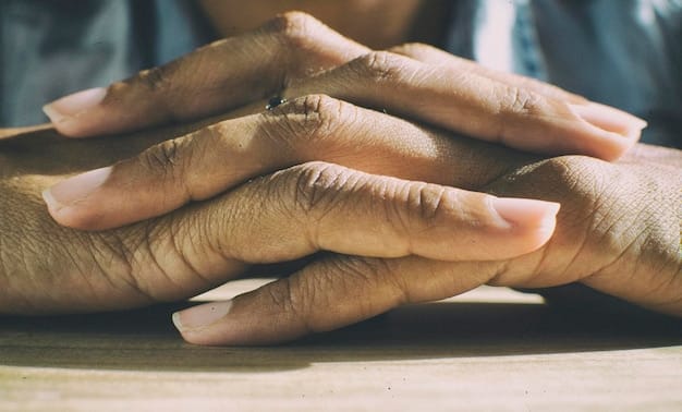 A close-up of two diverse hands, one older and one younger, gently clasping, symbolizing compassion and intergenerational support. The background is softly blurred to indicate focus on the hands.