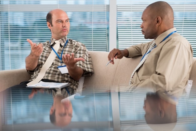 A manager providing constructive feedback to an employee in a one-on-one setting, emphasizing professional development and open communication.