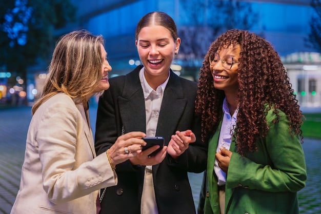 A diverse group of young professionals smiling and exchanging business cards at a bustling networking event, with blurred city lights in the background.