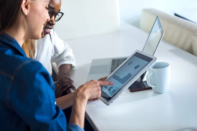 A person with a visual impairment using a screen reader on a laptop, with accessible website content displayed. Focus on the user's interaction with technology.