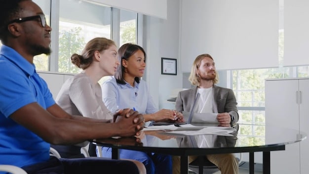 A healthcare administrator is leading a training session for a group of healthcare professionals. They are discuss various communication techniques, with emphasis on active listening and cultural sensitivity, using diagrams and a whiteboard in a modern conference room.